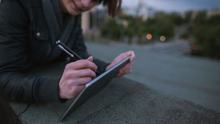 young man drawing on tablet