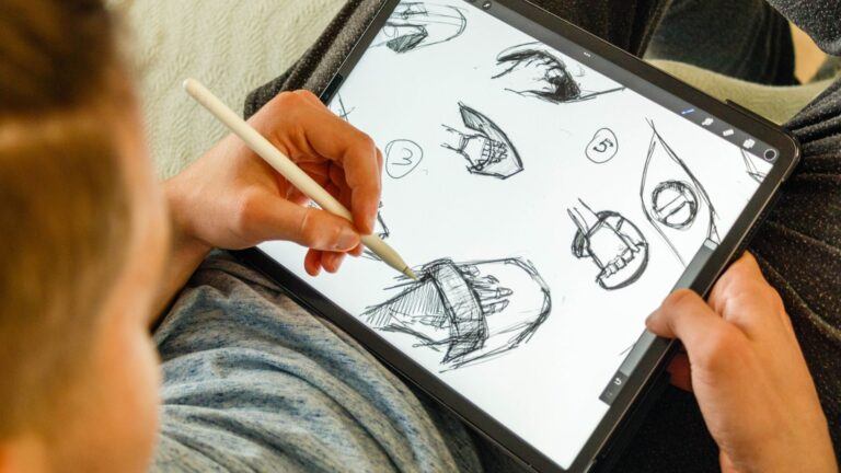 man using drawing tablet accessories like stylus